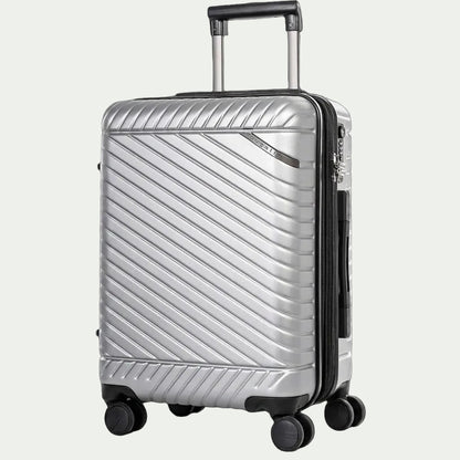 Silver Bugatti Oslo carry-on luggage with textured polycarbonate shell, telescoping handle, and spinner wheels.