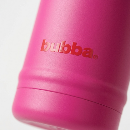 An extreme close-up photograph capturing the textured pink stainless steel body, crisp 'bubba.' logo, distinct molded ribbing, and base contours.