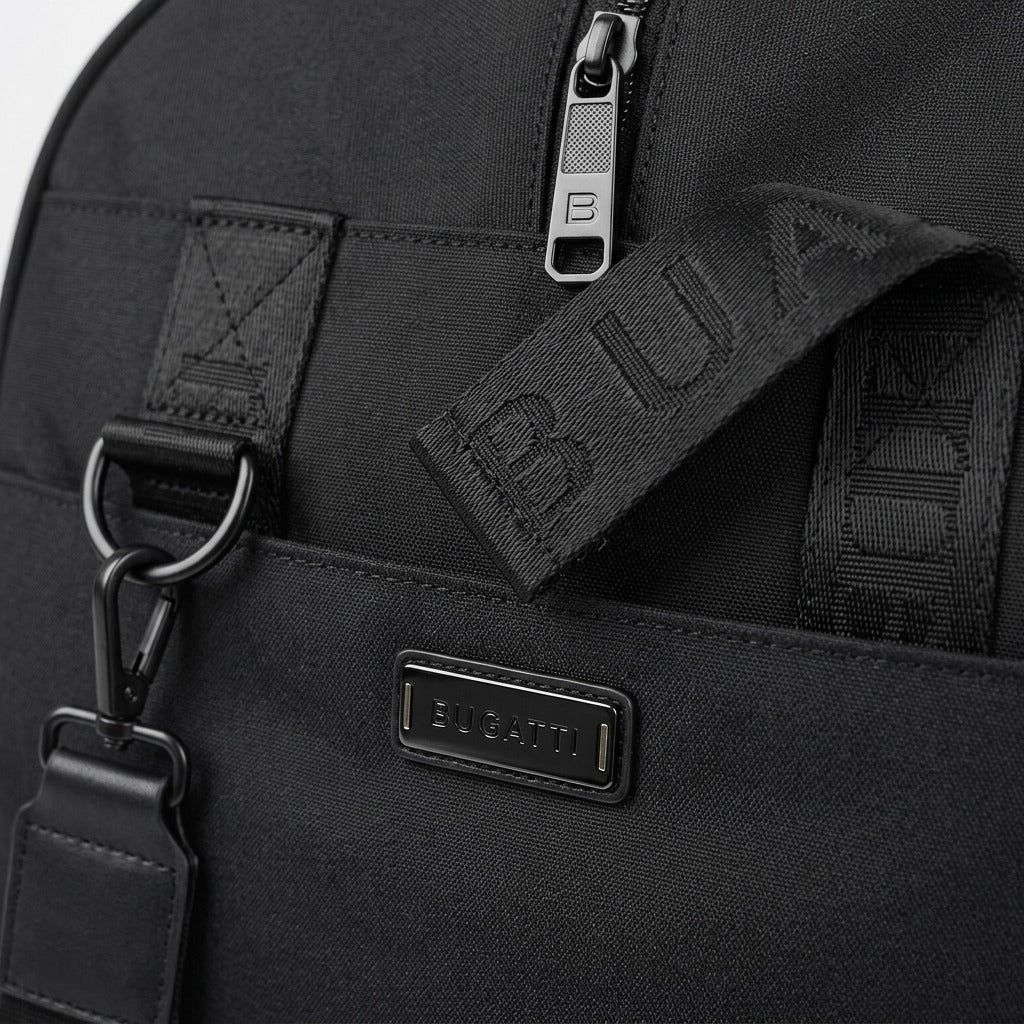 Macro detail of the Bugatti Reborn duffle bag's black RPET fabric, metal zipper, and logo hardware.