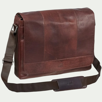 Brown Mancini Buffalo Collection leather messenger bag with adjustable shoulder strap and logo.