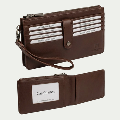 A high-resolution, centered eCommerce hero shot of the Mancini brown leather ladies' wristlet, showcasing its front detail and side profile with the wrist strap.