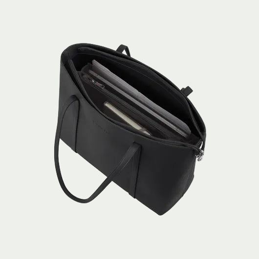Black handbag with a shoulder strap on a white background