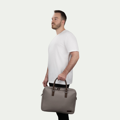 Bugatti Contrast briefcase in grey, held by a model
