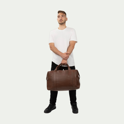 Bugatti Palermo duffle bag in cognac, held by a model