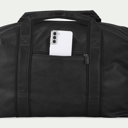 Bugatti Valentino duffle bag in black, rear pocket holding a phone