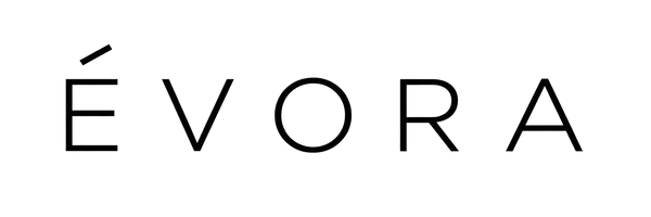The wordmark 'ÉVORA' in thin black sans-serif lettering on transparent background.