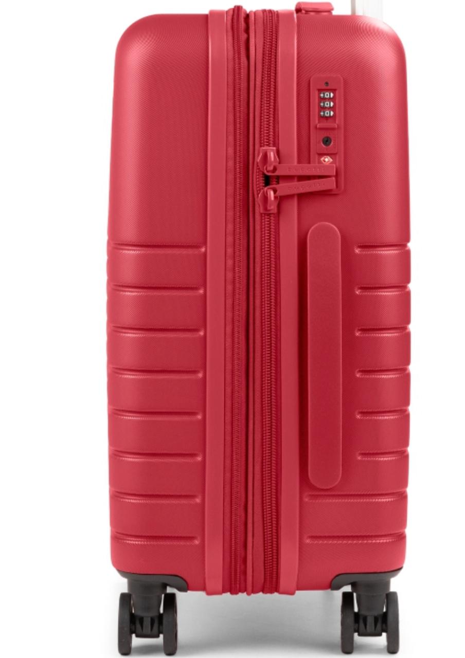 A red hard-shell spinner suitcase with a vertical zipper, textured horizontal ridges, a built-in handle, and a combination lock, shown on a plain white background.