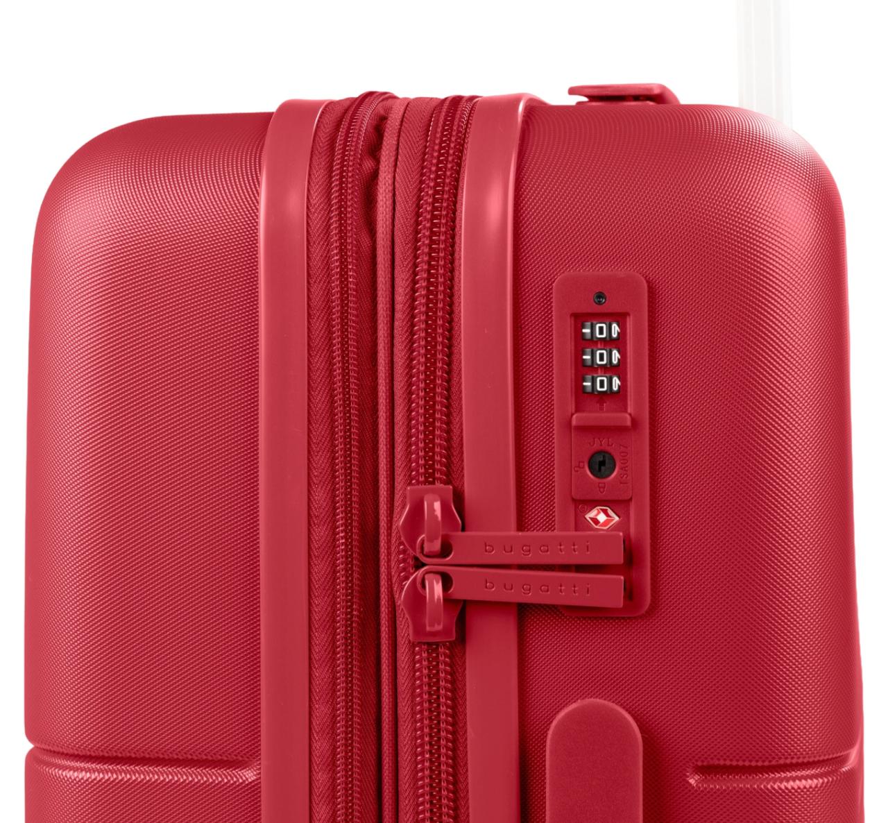 Close-up of a red hard-shell suitcase showing the zipper, combination lock, and textured shell material.