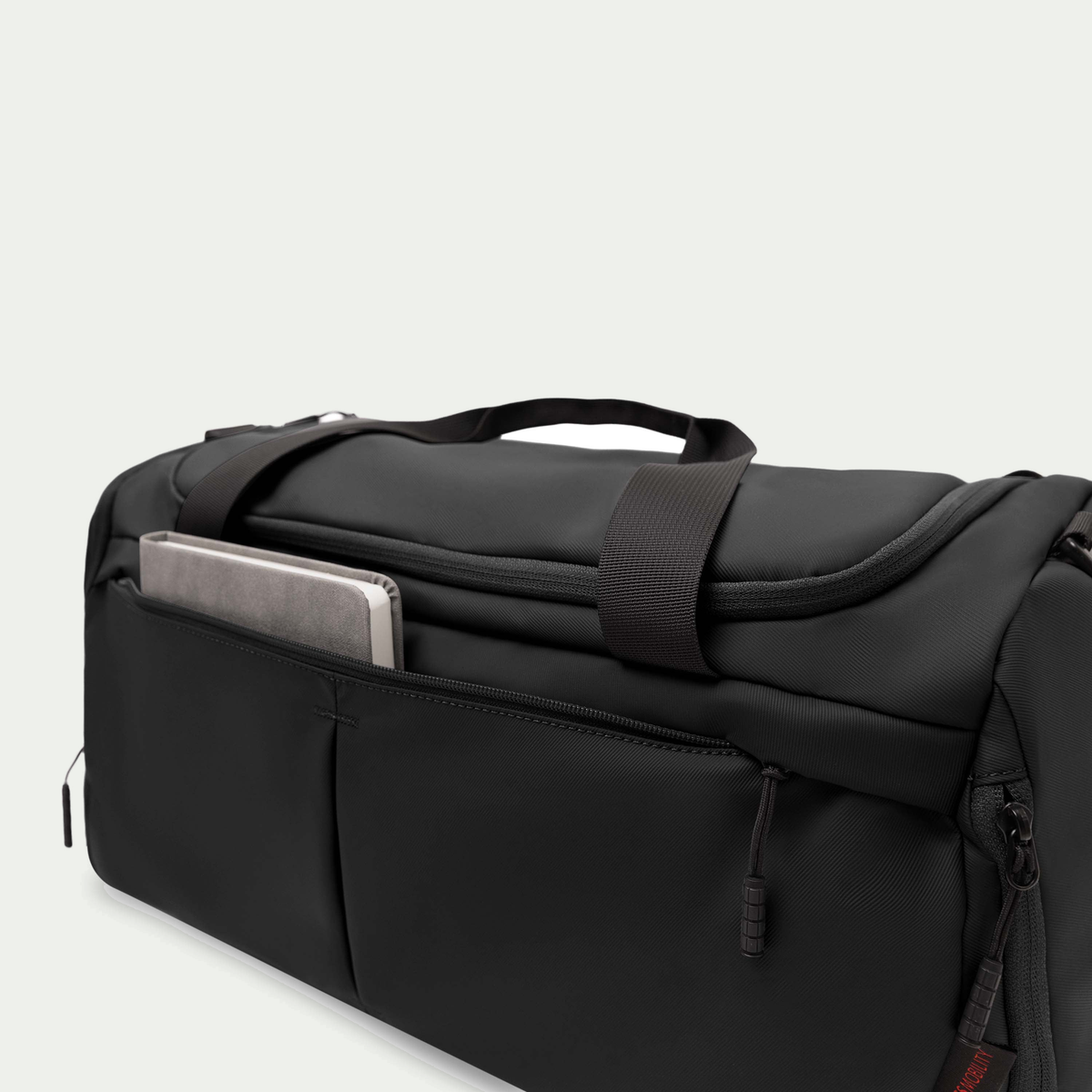 Swiss Mobility Active City Duffle Bag Black, front tablet pocket close-up