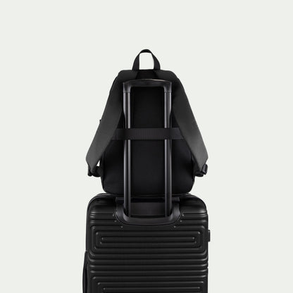 Swiss Mobility Urban Pro Backpack Black, rear trolley sleeve shown over a suitcase handle