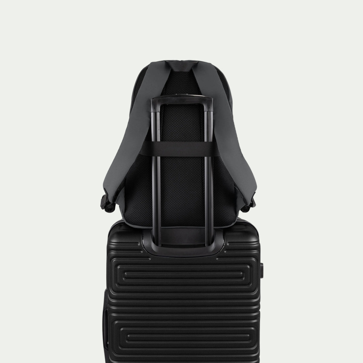 Swiss Mobility Urban Pro Backpack Grey, rear trolley sleeve shown over a suitcase handle