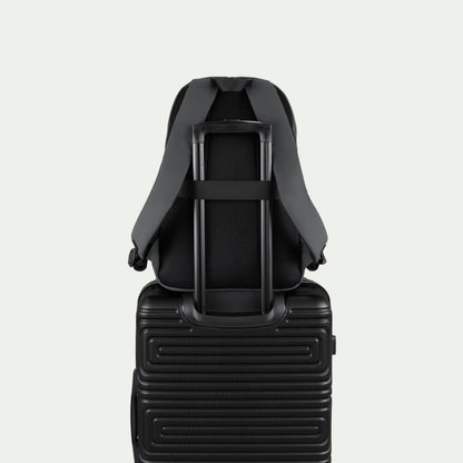 Swiss Mobility Urban Pro Backpack Grey, rear trolley sleeve shown over a suitcase handle