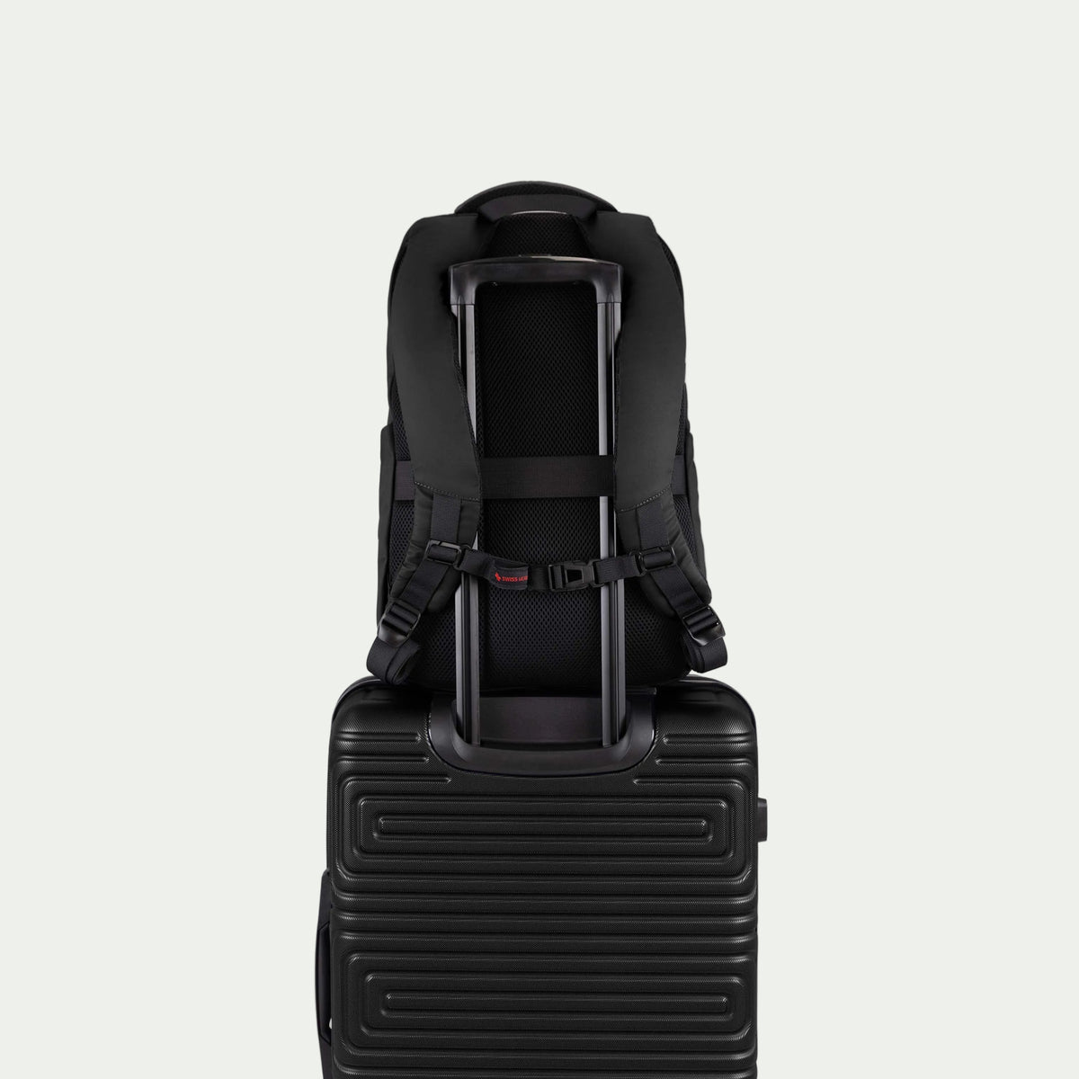 Swiss Mobility Active City Backpack Black, rear trolley sleeve shown over a suitcase handle