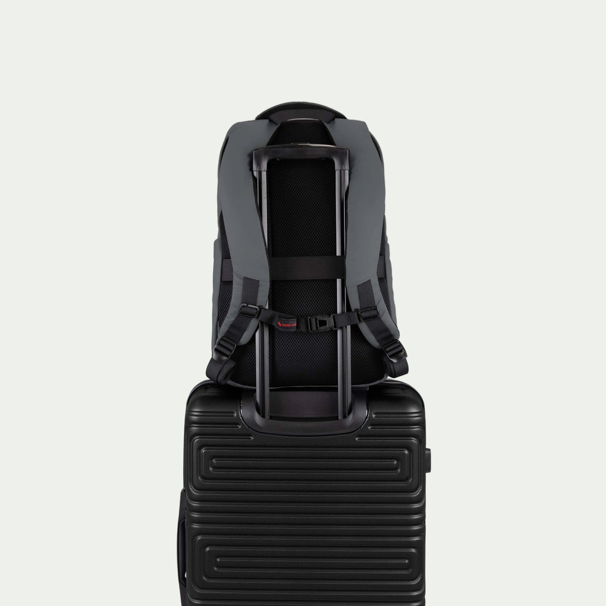Swiss Mobility Active City Backpack Grey, rear trolley sleeve shown over a suitcase handle