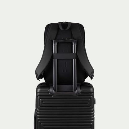 Swiss Mobility Urban Pro Backpack Black, rear trolley sleeve shown over a suitcase handle