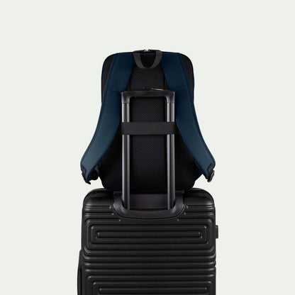 Swiss Mobility Urban Pro Backpack Navy, rear trolley sleeve shown over a suitcase handle