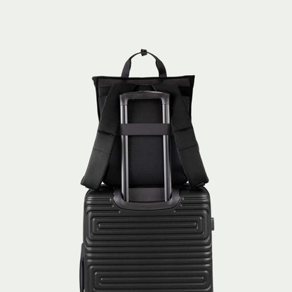 Swiss Mobility Urban Pro Backpack Black, rear trolley sleeve shown over a suitcase handle