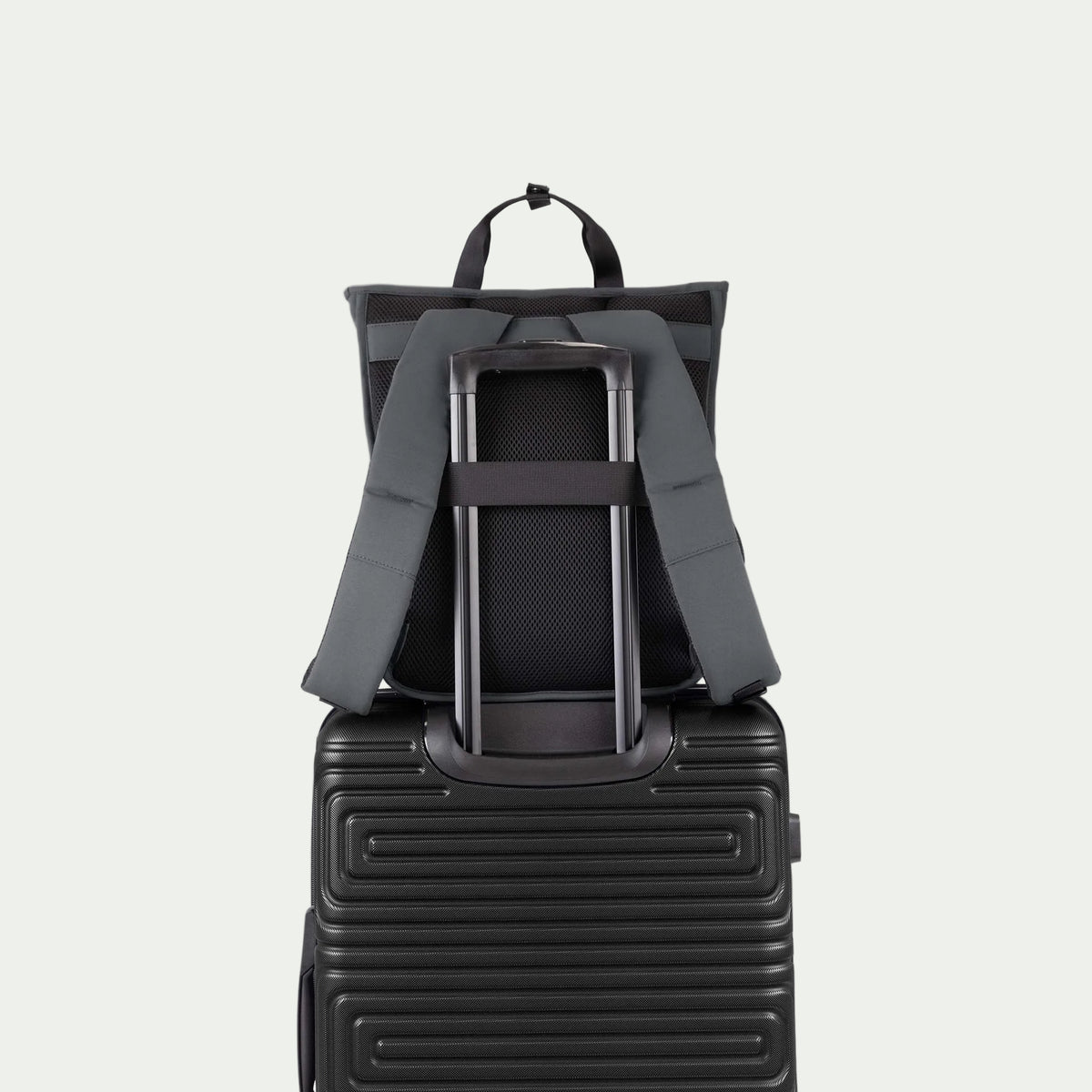 Swiss Mobility Urban Pro Backpack Grey, rear trolley sleeve shown over a suitcase handle