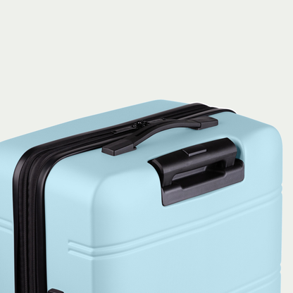 Swiss Mobility LAX three-piece luggage set in light blue, rear handle detail